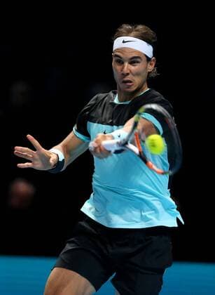 Rafael Nadal of Spain returns the ball during the match against Stan Wawrinka of Switzerland at the ATP Tennis Herren World Tour Finals at the O2 Arena in London, Britain, Nov. 16, 2015. Rafael Nadal won 2-0. ) (SP)BRITAIN-LONDON-TENNIS-ATP FINAL-NADAL VS WAWRINKA HanxYan 