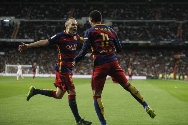 Barcelona s Iniesta celebrates a goal with Neymar Jr during 2015-16 La Liga match between Real Madrid and Barcelona at Santiago Bernabeu stadium in Madrid, Spain. November 21, 2015.  (20151121049)