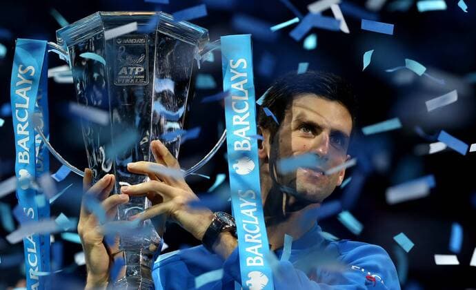 (151123) -- LONDON, Nov. 22, 2015 -- Novak Djokovic of Serbia celebrates with the trophy after winning the men s single s final against Roger Federer of Switzerland at the ATP Tennis Herren World Tour Finals at the O2 Arena in London, Britain, Nov. 22, 2015. Djokovic won 2-0. )? (SP)BRITAIN-LONDON-TENNIS-ATP FINAL-FEDERER VS DJOKOVIC HanxYan 