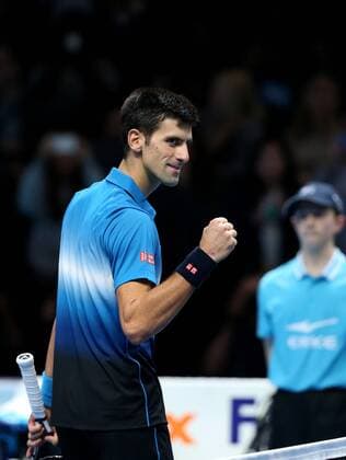 (151123) -- LONDON, Nov. 22, 2015 -- Novak Djokovic of Serbia celebrates after winning the men s single s final against Roger Federer of Switzerland at the ATP Tennis Herren World Tour Finals at the O2 Arena in London, Britain, Nov. 22, 2015. Djokovic won 2-0. )? (SP)BRITAIN-LONDON-TENNIS-ATP FINAL-FEDERER VS DJOKOVIC HanxYan 