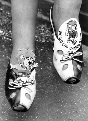 1966 World Cup decorative shoes worn by a female fan at the England v Uruguay match. 11th July 1966 Great Britain Mono Print UnitedArchives00462847