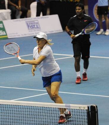 KOLKATA, INDIA - NOVEMBER 25: Czech tennis star Martina Navratilova with Indian tennis player Leander Paes in action match against Indian tennis players Sania Mirza and Mahesh Bhupathi at Kolkata Netaji Indor Stadium, on November 25, 2015 in Kolkata, India. During her visit, Navratilova will play three matches in Kolkata, Hyderabad and New Delhi, as part of International Premier Tennis League s promotional tour. (Photo by Subhankar Chakraborty Hindustan Times ) Czech Tennis Star Martina Navratilova In Kolkata