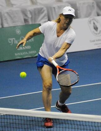 KOLKATA, INDIA - NOVEMBER 25: Czech tennis star Martina Navratilova with Indian tennis player Leander Paes in action match against Indian tennis players Sania Mirza and Mahesh Bhupathi at Kolkata Netaji Indor Stadium, on November 25, 2015 in Kolkata, India. During her visit, Navratilova will play three matches in Kolkata, Hyderabad and New Delhi, as part of International Premier Tennis League s promotional tour. (Photo by Subhankar Chakraborty Hindustan Times ) Czech Tennis Star Martina Navratilova In Kolkata