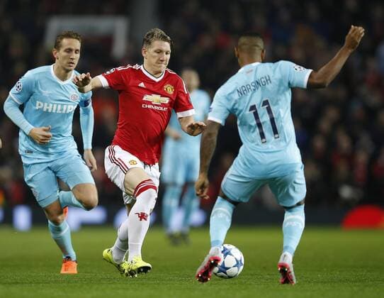 Bastian Schweinsteiger of Manchester United ManU pressures Luciano Narsingh of PSV Eindhoven - UEFA Champions League Group B - Manchester Utd vs PSV Eindhoven - Old Trafford Stadium - Manchester - England - 25th November 2015 - Pic Simon Bellis Sportimage EDITORIAL USE ONLY. No use with unauthorised audio, video, data, fixture lists, club league logos or live services. Online in-match use limited to 120 images, no video emulation. No use in betting, games or single club league player publications.