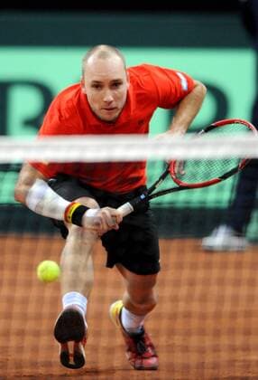 Tennis - 2015 Davis Cup by BNP Paribas - World Group Final: Belgium vs. Great Britain Day Two Rubber Three: Doubles David Goffin (Bel) and Steve Darcis (Bel) vs. Andy Murray (GB) and Jamie Murray (GB) Belgium s Steve Darcis in action during the match at the Flanders Expo, Ghent. COLORSPORT JANE BARLOW 