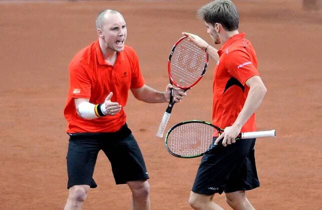 Tennis - 2015 Davis Cup by BNP Paribas - World Group Final: Belgium vs. Great Britain Day Two Rubber Three: Doubles David Goffin (Bel) and Steve Darcis (Bel) vs. Andy Murray (GB) and Jamie Murray (GB) Belgium s (left to right) Steve Darcis and David Goffin in action during the match at the Flanders Expo, Ghent. COLORSPORT JANE BARLOW 
