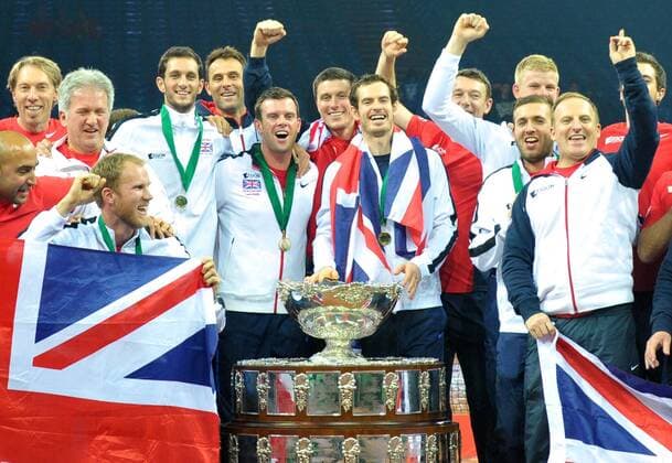 Tennis - 2015 Davis Cup by BNP Paribas - World Group Final: Belgium vs. Great Britain Day Three Rubber Four: Singles David Goffin (Bel) vs. Andy Murray (GB) Great Britain s Andy Murray celebrates winning his match with team-mates and winning the Davis Cup at the Flanders Expo, Ghent. COLORSPORT JANE BARLOW 