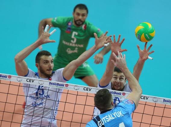 KAZAN, RUSSIA. DECEMBER 2, 2015. Halkbank s Resul Tekeli, Michal Kubiak (L-R background) block Zenit s Alexander Gutsalyuk (front) in their 2015 16 Season CEV Champions League Group D Round 3 volleyball match. VC Zenit Kazan won the game 3:0. Yegor Aleyev TASS  TS01301A