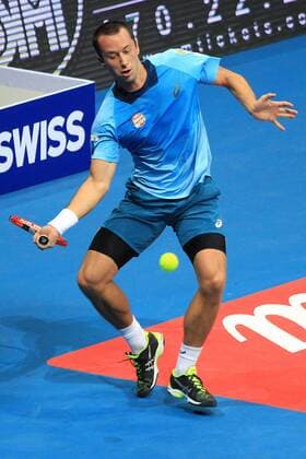 (151206) -- PASAY CITY, Dec. 6, 2015 -- Japan Warriors player Philipp Kohlschreiber of Germany returns the ball against Singapore Slammers player Nick Kyrgios of Australia during their match in the International Premier Tennis League (IPTL) in Pasay City, Philippines, Dec. 6, 2015. Kyrgios won 6-5. ) (SP)PHILIPPINES-PASAY CITY-TENNIS-IPTL RouellexUmali 