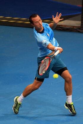 (151206) -- PASAY CITY, Dec. 6, 2015 -- Japan Warriors player Philipp Kohlschreiber of Germany returns the ball against Singapore Slammers player Nick Kyrgios of Australia during their match in the International Premier Tennis League (IPTL) in Pasay City, Philippines, Dec. 6, 2015. Kyrgios won 6-5. ) (SP)PHILIPPINES-PASAY CITY-TENNIS-IPTL RouellexUmali 