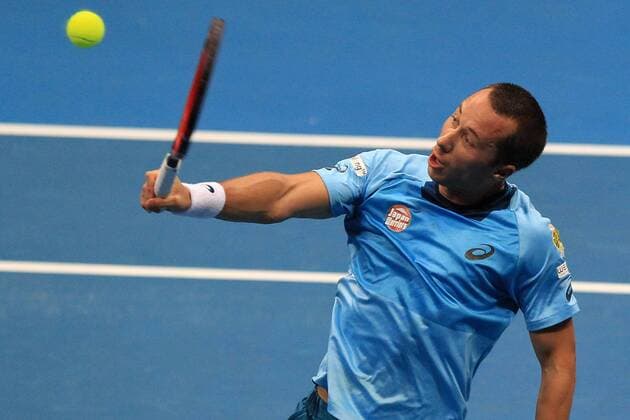 (151206) -- PASAY CITY, Dec. 6, 2015 -- Japan Warriors player Philipp Kohlschreiber of Germany returns the ball against Singapore Slammers player Nick Kyrgios of Australia during their match in the International Premier Tennis League (IPTL) in Pasay City, Philippines, Dec. 6, 2015. Kyrgios won 6-5. ) (SP)PHILIPPINES-PASAY CITY-TENNIS-IPTL RouellexUmali 