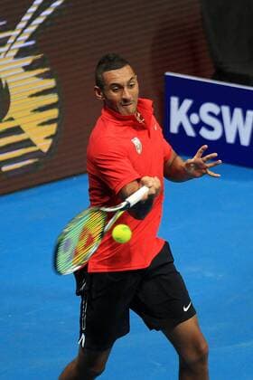 (151206) -- PASAY CITY, Dec. 6, 2015 -- Singapore Slammers player Nick Kyrgios of Australia returns the ball against Japan Warriors player Philipp Kohlschreiber of Germany during their match in the International Premier Tennis League (IPTL) in Pasay City, Philippines, Dec. 6, 2015. Kyrgios won 6-5. ) (SP)PHILIPPINES-PASAY CITY-TENNIS-IPTL RouellexUmali 