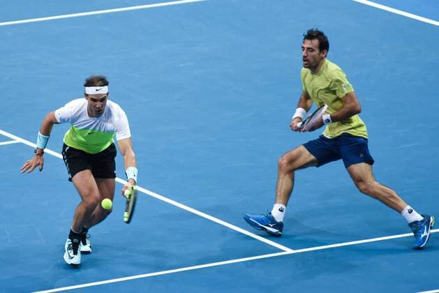 Dec. 7, 2015 - Manila, Philippines - MANILA, Philippines - SpainÃ¢â‚¬â ¢s Rafael Nadal (L) and CroatiaÃ¢â‚¬â ¢s Ivan Dodig, both playing for the Micromax Indian Aces return the ball to their opponents, Canadian tennis player Daniel Nestor and Czech RepublicÃ¢â‚¬â ¢s Tomas Berdych both playing for the Obi UAE Royals for the International Premiere Tennis League (IPTL) held at the Mall of Asia Arena in Pasay City, south of Manila on 07 December 2015. International Premiere Tennis League in Manila  - ZUMAn230