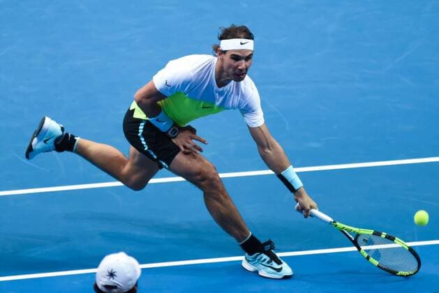 Dec. 7, 2015 - Manila, Philippines - MANILA, Philippines - 14-time Grand Slam singles winner Rafael Nadal tries to save the ball during the menÃ¢â‚¬â ¢s doubles match for the International Premiere Tennis League (IPTL) held at the Mall of Asia Arena in Pasay City, south of Manila on 07 December 2015. The Spanish player is in the country along with other international tennis superstars for the star-studded premiere league. International Premiere Tennis League in Manila  - ZUMAn230
