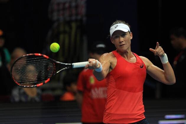 (151207) -- PASAY CITY, Dec. 7, 2015 -- Micromax Indian Aces player Samantha Stosur of Australia returns the ball to Obi UAE Royals player Ana Ivanovic of Serbia during their match in the International Premier Tennis League (IPTL) in Pasay City, the Philippines, Dec. 7, 2015. Stosur won 6-3. ) (SP)PHILIPPINES-PASAY CITY-TENNIS-IPTL ROUELLExUMALI 