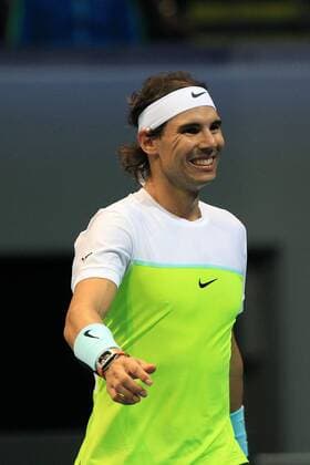 Bilder des Tages - SPORT (151207) -- PASAY CITY, Dec. 7, 2015 -- Micromax Indian Aces player Rafael Nadal of Spain smiles during the men s doubles match against Obi UAE Royals in the International Premier Tennis League (IPTL) in Pasay City, the Philippines, Dec. 7, 2015. Micromax Indian Aces won 6-3. ) (SP)PHILIPPINES-PASAY CITY-TENNIS-IPTL-MEN S DOUBLES ROUELLExUMALI 