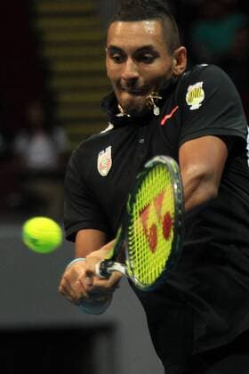 (151208) -- PASAY CITY, Dec. 8, 2015 -- OUE Singapore Slammers player Nick Kyrgios of Australia returns the ball to Obi UAE Royals player Tomas Berdych of Czech Republic during the men s singles match in the International Premier Tennis League in Pasay City, the Philippines, Dec. 8, 2015. Nick Kyrgios lost 4-6. ) (SP)PHILIPPINES-PASAY CITY-TENNIS-IPTL RouellexUmali 