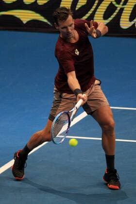 (151208) -- PASAY CITY, Dec. 8, 2015 -- Obi UAE Royals player Tomas Berdych of Czech Republic returns the ball to the OUE Singapore Slammers player Nick Kyrgios of Australia during the men s singles match in the International Premier Tennis League in Pasay City, the Philippines, Dec. 8, 2015. Tomas Berdych won 6-4. ) (SP)PHILIPPINES-PASAY CITY-TENNIS-IPTL RouellexUmali 
