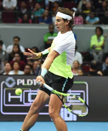 Dec. 8, 2015 - Manila, Philippines - MANILA, Philippines - SpainÃ¢â‚¬â ¢s Rafael Nadal of the Indian Aces touches in action during the menÃ¢â‚¬â ¢s singles match for the International Premiere Tennis League (IPTL) at the Mall of Asia Arena in Pasay City, south of Manila, Philippines on December 08, 2015. International Premiere Tennis League in Manila  - ZUMAn230