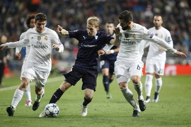 Real Madrid s Nacho and Kovacic and Malmo s Lewicki during 2015 16 Champions League soccer match between Real Madrid and Malmo at Santiago Bernabeu stadium in Madrid, Spain. December 08, 2014.  (20151208055)