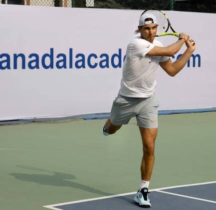 NEW DELHI, INDIA - DECEMBER 10: Rafael Nadal, Spanish Tennis player during the inaugural match for a tie-up between Rafael Nadal Academy and Mahesh Bhupathi Tennis Academies (MBTA) to identify talents in India and offer them the opportunity to receive expert coaching, at R.K. Khanna Tennis Complex , RK Puram, on December 10, 2015 in New Delhi, India. (Photo by Sanchit Khanna Hindustan Times ) Rafael Nadal And Mahesh Bhupathi Tennis Academies Tie Up For Collaboration