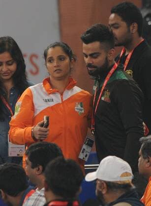 NEW DELHI, INDIA - DECEMBER 10: Tennis player Sania Mirza and Indian Cricketer Virat Kohli during the Coca Cola International Premier Tennis League at IG stadium, on December 10, 2015 in New Delhi, India. Legendary Japan Warriors won their first match of the International Premier Tennis League (IPTL) with a 24-21 margin against OBI UAE Royals. (Photo by Virendra Singh Gosain Hindustan Times ) Coca Cola International Premier Tennis League