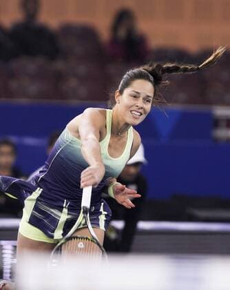 NEW DELHI, INDIA - DECEMBER 10: Ana Ivanovic of (Obi UAE Royals) in action against Kurumi Nara (Legendary Japan warriors) during the Coca Cola International Premier Tennis League at IG stadium, on December 10, 2015 in New Delhi, India. Legendary Japan Warriors won their first match of the International Premier Tennis League (IPTL) with a 24-21 margin against OBI UAE Royals. (Photo by Virendra Singh Gosain Hindustan Times ) Coca Cola International Premier Tennis League
