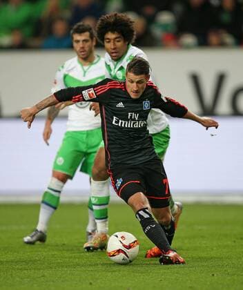 12.12.2015, Fussball 1.Bundesliga 2015 2016, 16.Spieltag, VfL Wolfsburg - Hamburger SV, in der Volkswagen Arena, Wolfsburg. v.l. Vieirinha (Wolfsburg) , Dante (Wolfsburg) gegen Ivo Ilicevic (Hamburg) 