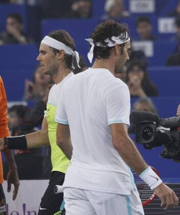 NEW DELHI, INDIA - DECEMBER 12: Rafael Nadal of Micromax Indian Aces Mens and Roger Federer of Obi UAE Royals during the Coca-Cola International premier Tennis League at IG Stadium on December 12, 2015 in New Delhi, India. (Photo by Virendra Singh Gosain Hindustan Times ) Coca-Cola International Premier Tennis League
