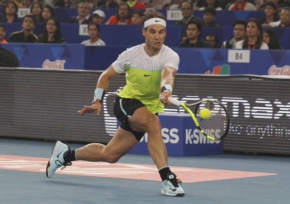 NEW DELHI, INDIA - DECEMBER 12: Rafael Nadal of Micromax Indian Aces Mens in action against Roger Federer of Obi UAE Royals during the Coca-Cola International premier Tennis League at IG Stadium on December 12, 2015 in New Delhi, India. (Photo by Virendra Singh Gosain Hindustan Times ) Coca-Cola International Premier Tennis League