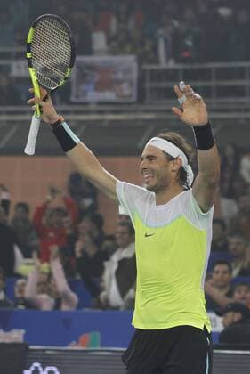 NEW DELHI, INDIA - DECEMBER 12: Rafael Nadal of Micromax Indian Aces Mens in action against Roger Federer of Obi UAE Royals during the Coca-Cola International premier Tennis League at IG Stadium on December 12, 2015 in New Delhi, India. (Photo by Virendra Singh Gosain Hindustan Times ) Coca-Cola International Premier Tennis League