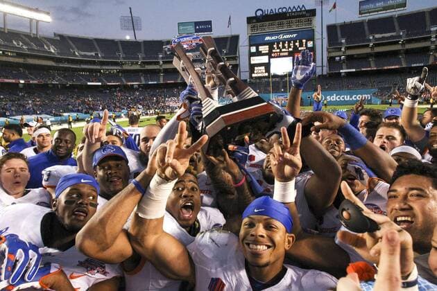 Dec. 23, 2015 - San Diego, USA - SAN DIEGO, December 23, 2015 Boise State players hold up the trophy after they beat NIU 55-7 during the Poinsettia Bowl at Qualcomm Stadium in San Diego on Wednesday. -Mandatory Photo Credit: Photo by Hayne Palmour IV San Diego Union-Tribune, LLC San Diego USA - ZUMAs44_ DEC 23 2015 San Diego USA San Diego December 23 2015 Boise State Players Hold up The Trophy After They Beat Niu 55 7 during The Poinsettia Bowl AT Qualcomm Stage in San Diego ON Wednesday Mandatory Photo Credit Photo by Hayne Palmour IV San Diego Union Tribune LLC San Diego USA ZUMAs44_ Dec 23 2015 San Diego USA SAN DIEGO December 23 2015 Boise State players hold up the trophy - ZUMA5