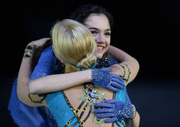 YEKATERINBURG, RUSSIA. DECEMBER 27, 2015. Gold medal winner Yevgenia Medvedeva (back) and bronze medallist Anna Pogorilaya share a hug with during the medal ceremony for the ladies singles Figure skating Eiskunstlauf competition at the 2015 2016 Russian Figure Skating Championships. Donat Sorokin TASS  TS014B91