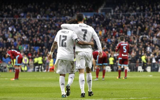Real Madrid s Portuguese striker Cristiano Ronaldo (R) jubilates with his team mate Marcelo Vieira (L) his second goal against Real Sociedad during their Primera Division soccer match played at Santiago Bernabeu stadium in Madrid, Spain on 30 December 2015. REAL MADRID VS REAL SOCIEDAD !ACHTUNG: NUR REDAKTIONELLE NUTZUNG! 