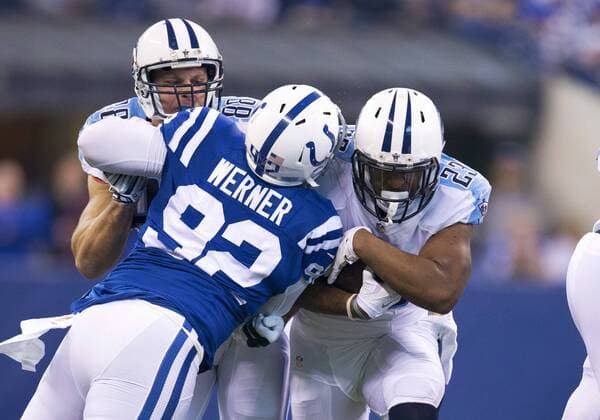 January 03, 2016: Tennessee Titans running back David Cobb (23) runs with the ball as Indianapolis Colts linebacker Bjoern Werner (92) attempts to make the tackle during NFL American Football Herren USA football game action between the Tennessee Titans and the Indianapolis Colts at Lucas Oil Stadium in Indianapolis, Indiana. Indianapolis defeated Tennessee 30-24. NFL 2016: Titans vs Colts JAN 03 - ZUMAc04_