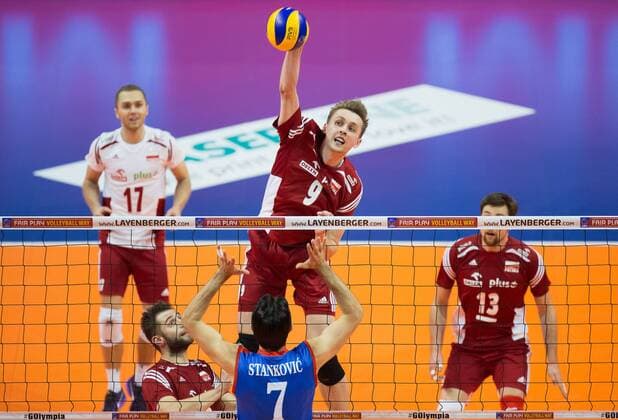 Berlin, Deutschland, 05.01.2016: Volleyball Olympia Qualifikation Männer Maenner 2016 - Spiel 3 Serbien - Polen. Mateusz Bieniek (Poland 9) against Dragan Stankovic (Serbia 7)