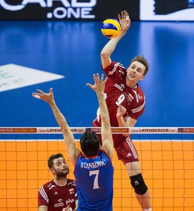 Berlin, Deutschland, 05.01.2016: Volleyball Olympia Qualifikation Männer Maenner 2016 - Spiel 3 Serbien - Polen. Mateusz Bieniek (Poland 9) against Dragan Stankovic (Serbia 7)