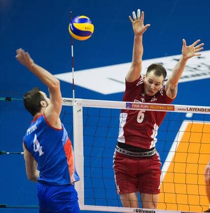 Berlin, Deutschland, 05.01.2016: Volleyball Olympia Qualifikation Männer Maenner 2016 - Spiel 3 Serbien - Polen. Nemanja Petric (Serbia 4) against Bartosz Kurek (Poland 6)