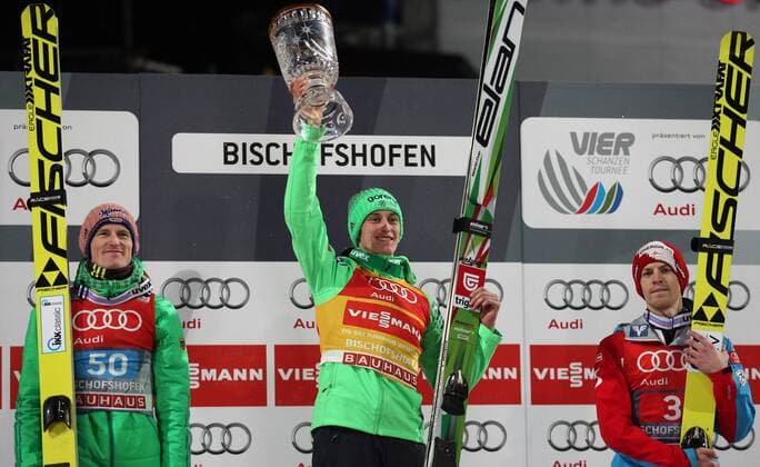 NORDIC SKIING - FIS WC Bischofshofen, Four Hills Tournament BISCHOFSHOFEN,AUSTRIA,06.JAN.16 - NORDIC SKIING, Ski jumping Skispringen Ski nordisch - FIS World Cup, Four Hills Tournament, large hill, men, award ceremony. Image shows the rejoicing of Severin Freund (GER), Peter Prevc (SLO) and Michael Hayboeck (AUT). Keywords: trophy. GEPAxpictures xThomasxBachun