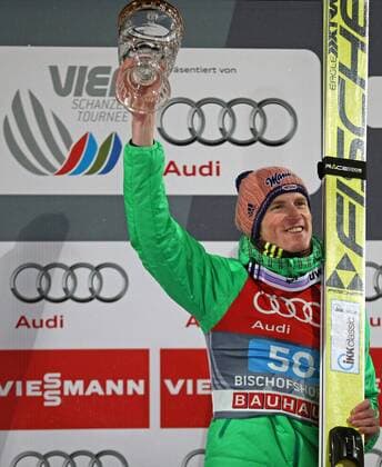 NORDIC SKIING - FIS WC Bischofshofen, Four Hills Tournament BISCHOFSHOFEN,AUSTRIA,06.JAN.16 - NORDIC SKIING, Ski jumping Skispringen Ski nordisch - FIS World Cup, Four Hills Tournament, large hill, men, award ceremony. Image shows the rejoicing of Severin Freund (GER). Keywords: trophy. GEPAxpictures xThomasxBachun