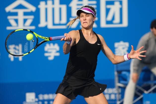 SHENZHEN, CHINA - JANUARY 07: (CHINA OUT) Eugenie Bouchard of Canada returns a shot against Timea Babos of Hungary in quarter finals match during Day five of 2016 WTA Tennis Damen Shenzhen Open at Longgang Sports Center on January 7, 2016 in Shenzhen, Guangdong Province of China.  CFP477886442 