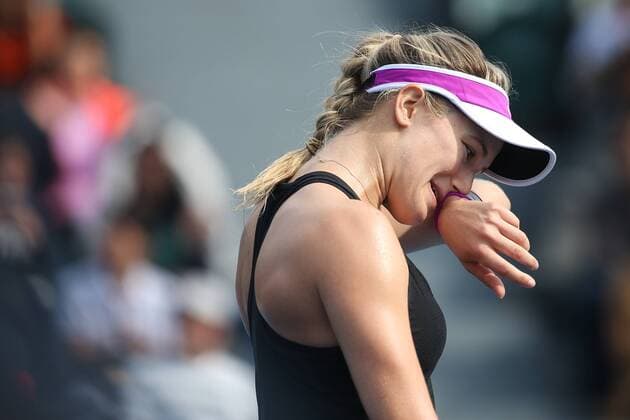 SHENZHEN, CHINA - JANUARY 07: (CHINA OUT) Eugenie Bouchard of Canada reacts against Timea Babos of Hungary in quarter finals match during Day five of 2016 WTA Tennis Damen Shenzhen Open at Longgang Sports Center on January 7, 2016 in Shenzhen, Guangdong Province of China.  CFP477886443 