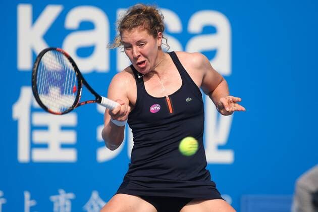 SHENZHEN, CHINA - JANUARY 08: (CHINA OUT) Anna-Lena Friedsam of Germany returns a shot against Agnieszka Radwanska of Poland in Women s semi-final match during Day six of 2016 WTA Tennis Damen Shenzhen Open at Longgang Sports Center on January 8, 2016 in Shenzhen, Guangdong Province of China.  CFP477921495 