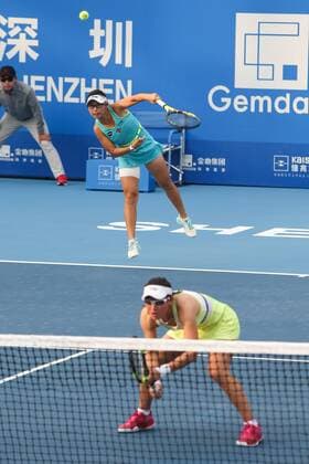 SHENZHEN, CHINA - JANUARY 08: (CHINA OUT) Xu Yifan (L) and Zheng Saisai of China return a shot against Cagla Buyukakcay of Turkey and Alexandra Krunic of Serbia in Women s doubles semi-final match during Day six of 2016 WTA Tennis Damen Shenzhen Open at Longgang Sports Center on January 8, 2016 in Shenzhen, Guangdong Province of China.  CFP477926681 