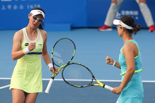 SHENZHEN, CHINA - JANUARY 08: (CHINA OUT) Xu Yifan (R) and Zheng Saisai of China celebrate against Cagla Buyukakcay of Turkey and Alexandra Krunic of Serbia in Women s doubles semi-final match during Day six of 2016 WTA Tennis Damen Shenzhen Open at Longgang Sports Center on January 8, 2016 in Shenzhen, Guangdong Province of China.  CFP477926683 