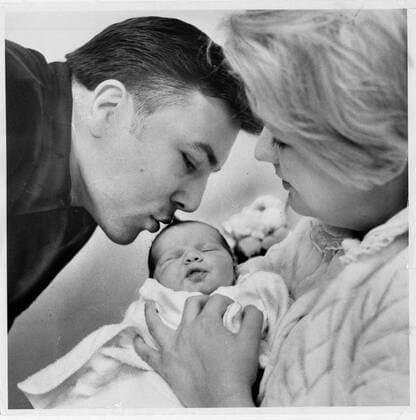 Canadian boxing champ George Chuvalo views his new daughter, Vanessa, being held by his wife Lynne  - ZUMAt14_