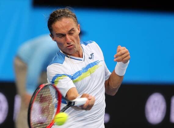 (160109) -- PERTH, Jan. 9, 2016 -- Alexandr Dolgopolov of Ukraine hits a return during the men s singles match against Nick Kyrgios of Australia at the Hopman Cup tennis tournament in Perth, Australia, Jan. 9, 2016. Kyrgios won 2-0. ) (SP)AUSTRALIA-PERTH-TENNIS-HOPMAN CUP ZhouxDan 