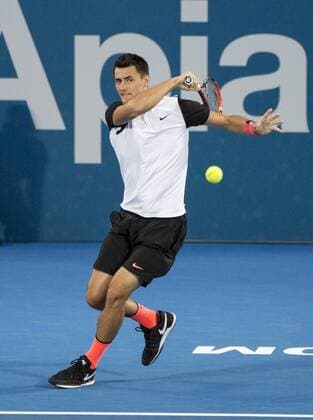 SYDNEY, Jan. 13, 2016 -- Bernard Tomic of Australia hits a return during the men s singles round of 16 match against compatriot Jordan Thompson at the Apia International Sydney in Sydney, Australia, on Jan. 13, 2016. Bernard Tomic won 2-0. ) (SP)AUSTRALIA-SYDNEY-TENNIS-INTERNATIONAL ZhuxHongye 