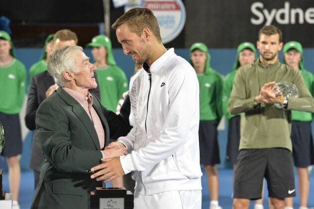 16.01.16 Sydney, Australia. Viktor Troicki (SRB) wins the mens singles title defeating Grigor Dimitrov (BUL) in the mens singles final match at the Apia International Sydney. He receives the trophy from Ken Roewall. Troicki won the final 2-6,6-1,7-6. xNigelxOwenx  ActionPlus11697410