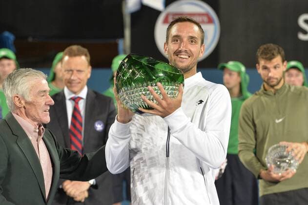 16.01.16 Sydney, Australia. Viktor Troicki (SRB) with trophy as he wins the mens singles title defeating Grigor Dimitrov (BUL) in the mens singles final match at the Apia International Sydney. He receives the trophy from Ken Roewall. Troicki won the final 2-6,6-1,7-6. xNigelxOwenx  ActionPlus11697412